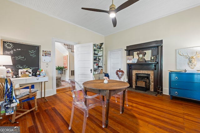 514 S Jefferson St, Washington, GA 30673 - dining space with ornamental molding, wood finished floors, a ceiling fan, stairs, and a fireplace