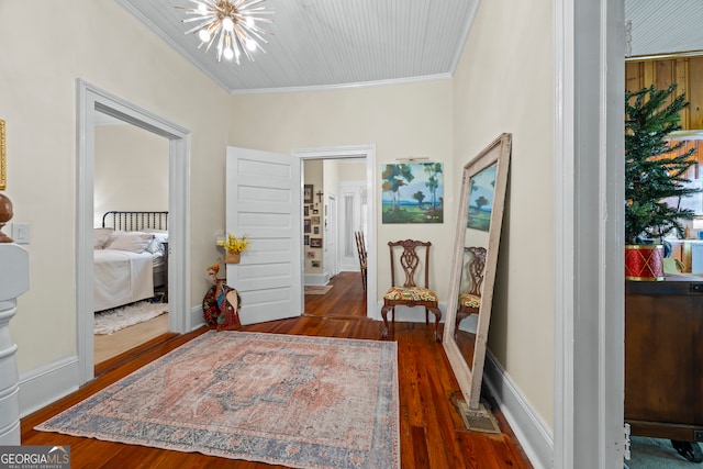 514 S Jefferson St, Washington, GA 30673 - entrance foyer featuring crown molding, a chandelier, and wood finished floors