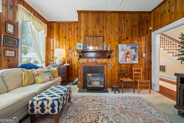 514 S Jefferson St, Washington, GA 30673 - carpeted living area featuring wood walls and stairs