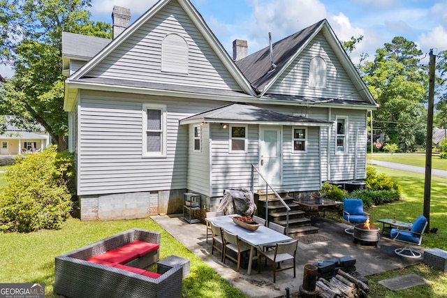 514 S Jefferson St, Washington, GA 30673 - back of house featuring entry steps, a patio area, a chimney, and a lawn