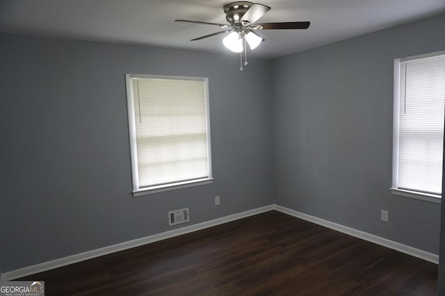 39 Mcferrin Cir, Riverdale, GA 30274 - empty room featuring a ceiling fan, dark wood finished floors, and plenty of natural light