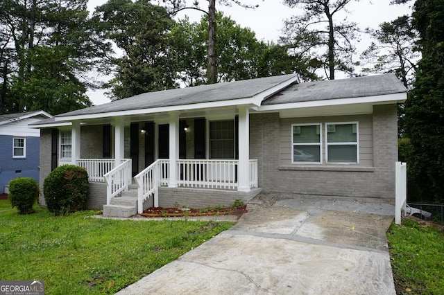 39 Mcferrin Cir, Riverdale, GA 30274 - view of front of home with brick siding, covered porch, and a front yard