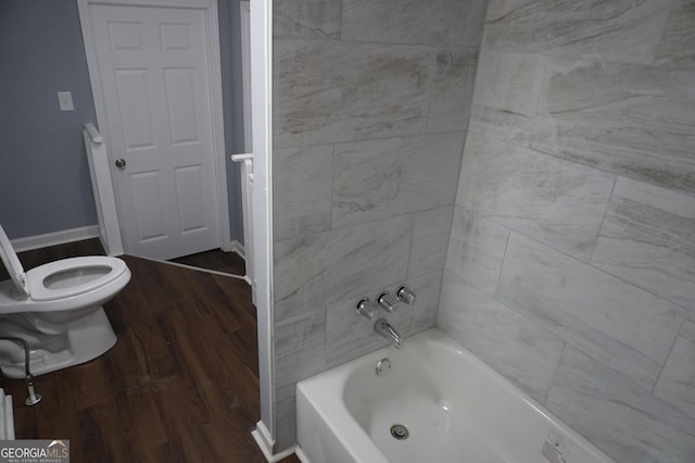 39 Mcferrin Cir, Riverdale, GA 30274 - bathroom featuring wood finished floors and shower / washtub combination