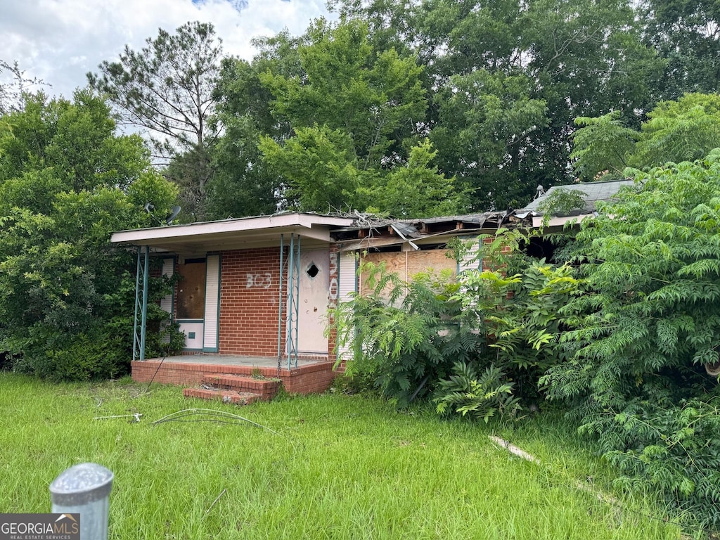 303 Hudson St, Dublin, GA 31021 - view of front of house with brick siding