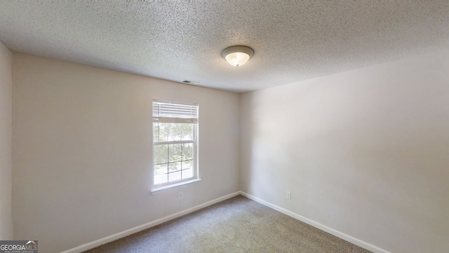 3157 Peartree Dr NW, Acworth, GA 30101 - spare room featuring carpet flooring and a textured ceiling