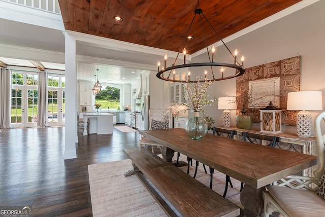 2816 Oconee Springs Dr, Statham, GA 30666 - dining area featuring crown molding, a chandelier, wooden ceiling, and dark wood finished floors