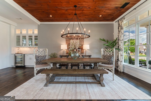 2816 Oconee Springs Dr, Statham, GA 30666 - dining room with wine cooler, wood ceiling, dark wood-type flooring, a bar, and a chandelier