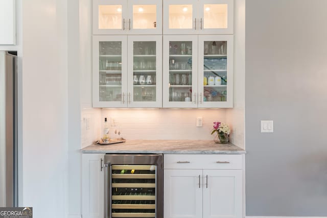 2816 Oconee Springs Dr, Statham, GA 30666 - indoor dry bar with beverage cooler, decorative backsplash, and freestanding refrigerator