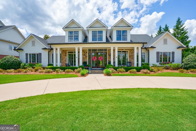 2816 Oconee Springs Dr, Statham, GA 30666 - view of front of house with a porch, stone siding, and a front yard