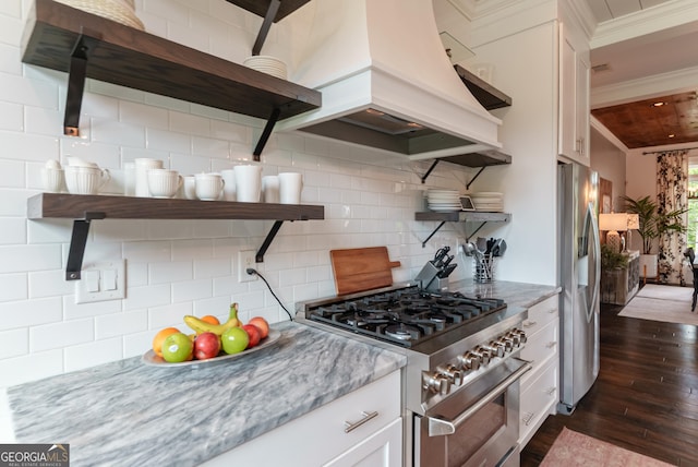 2816 Oconee Springs Dr, Statham, GA 30666 - kitchen with stainless steel appliances, dark wood-type flooring, open shelves, custom exhaust hood, and white cabinets