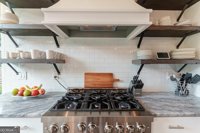 2816 Oconee Springs Dr, Statham, GA 30666 - kitchen with custom range hood, stove, decorative backsplash, and light stone countertops