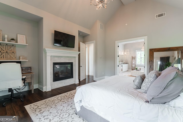 2816 Oconee Springs Dr, Statham, GA 30666 - bedroom with high vaulted ceiling, dark wood-type flooring, a fireplace, a chandelier, and an office area