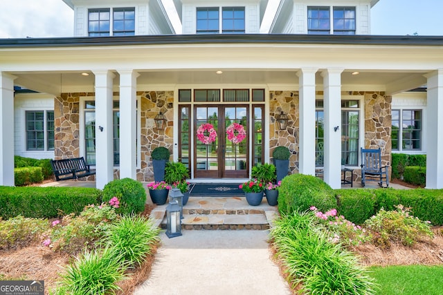 2816 Oconee Springs Dr, Statham, GA 30666 - entrance to property featuring stone siding and a porch