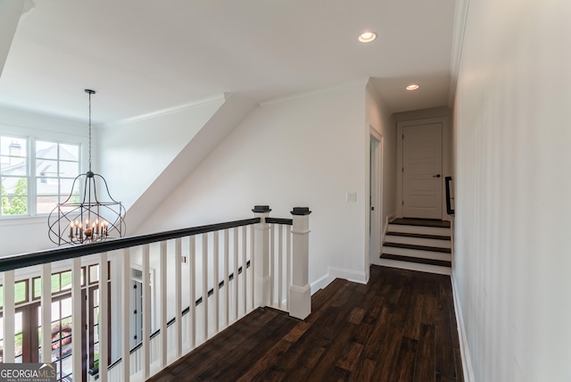 2816 Oconee Springs Dr, Statham, GA 30666 - hallway featuring a chandelier, dark wood-style floors, recessed lighting, crown molding, and an upstairs landing