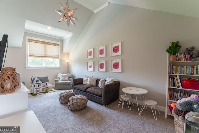 2816 Oconee Springs Dr, Statham, GA 30666 - carpeted living room featuring vaulted ceiling and baseboards