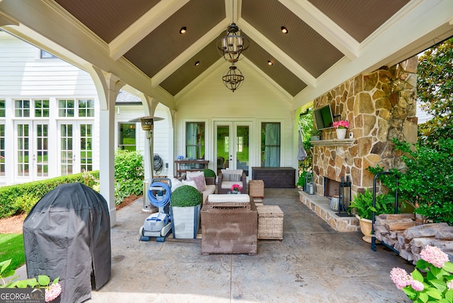 2816 Oconee Springs Dr, Statham, GA 30666 - view of patio featuring french doors, an outdoor living space with a fireplace, and area for grilling
