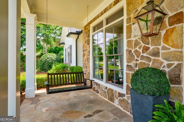 2816 Oconee Springs Dr, Statham, GA 30666 - entrance to property with stone siding and a porch