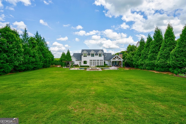 2816 Oconee Springs Dr, Statham, GA 30666 - view of green lawn featuring a patio area and an outdoor fire pit
