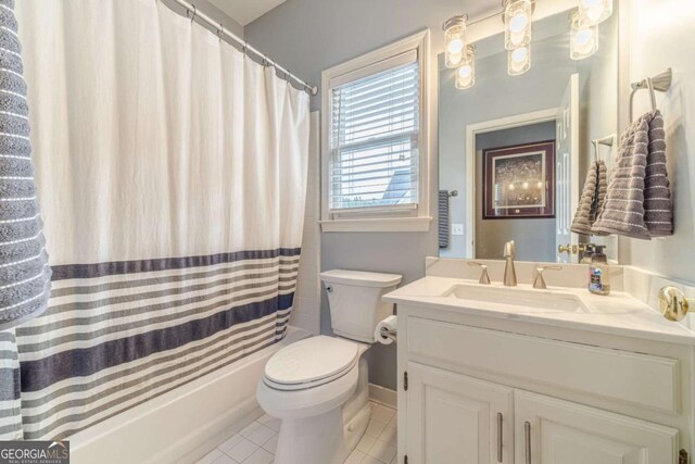 1461 Radstone Dr, Lawrenceville, GA 30044 - bathroom featuring tile patterned flooring, vanity, and shower / bath combo