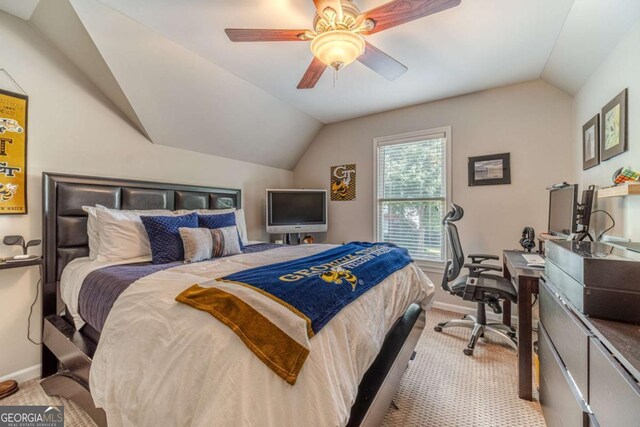 1461 Radstone Dr, Lawrenceville, GA 30044 - bedroom with vaulted ceiling, carpet flooring, an office area, and a ceiling fan