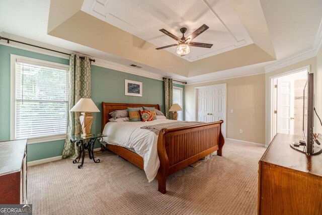 1461 Radstone Dr, Lawrenceville, GA 30044 - bedroom with a tray ceiling, light colored carpet, crown molding, and ceiling fan