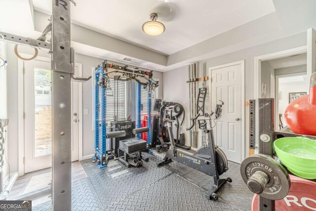 1461 Radstone Dr, Lawrenceville, GA 30044 - workout room featuring a tray ceiling and baseboards