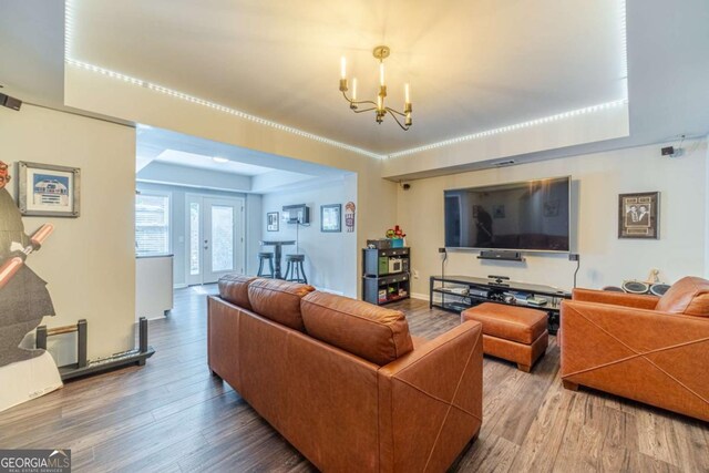 1461 Radstone Dr, Lawrenceville, GA 30044 - living room featuring wood finished floors and a chandelier
