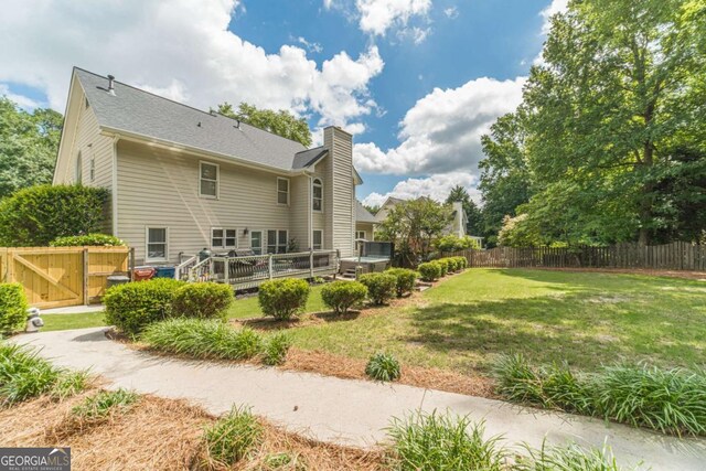 1461 Radstone Dr, Lawrenceville, GA 30044 - back of house featuring a chimney and a deck