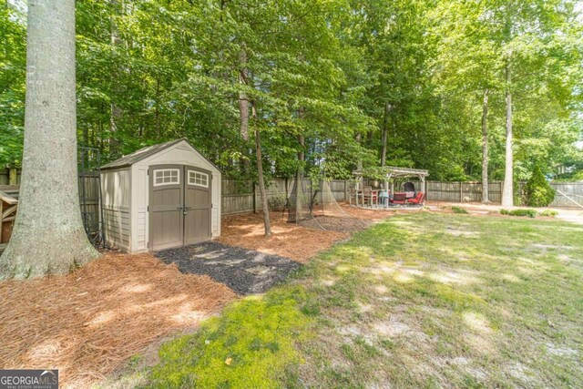 1461 Radstone Dr, Lawrenceville, GA 30044 - fenced backyard featuring a shed and a pergola