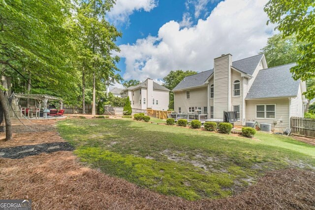 1461 Radstone Dr, Lawrenceville, GA 30044 - fenced backyard with a pergola and a patio area