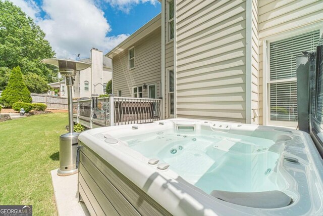 1461 Radstone Dr, Lawrenceville, GA 30044 - wooden deck featuring washer / dryer, a hot tub, and a yard