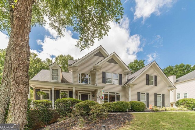 1461 Radstone Dr, Lawrenceville, GA 30044 - traditional-style home featuring a front lawn