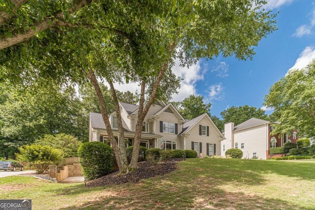1461 Radstone Dr, Lawrenceville, GA 30044 - view of front facade featuring a front lawn