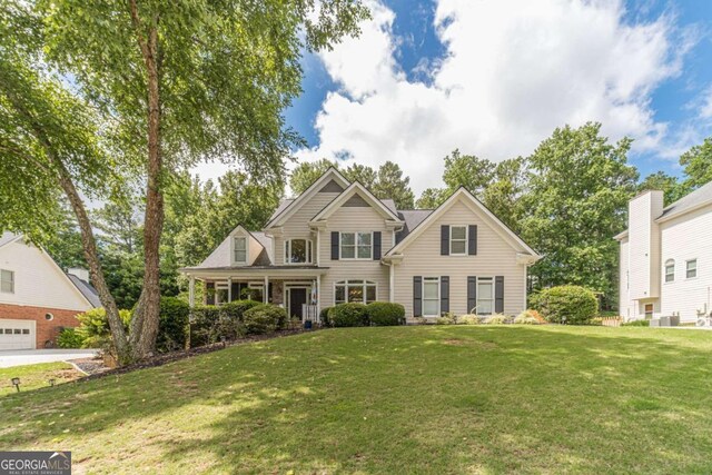 1461 Radstone Dr, Lawrenceville, GA 30044 - traditional-style house with a front yard