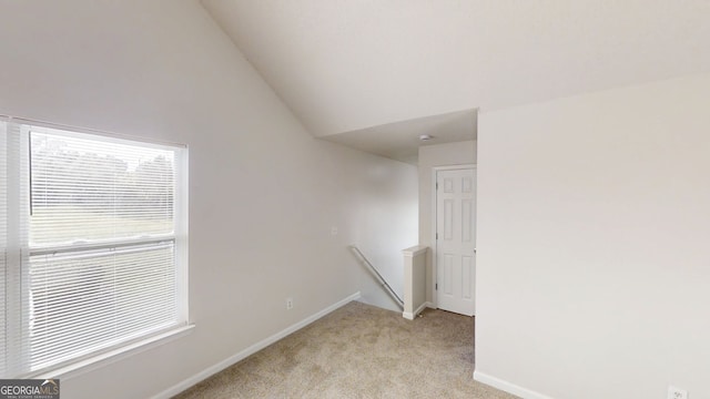 1001 Balsam Wood Trl, Villa Rica, GA 30180 - unfurnished room featuring light colored carpet and lofted ceiling