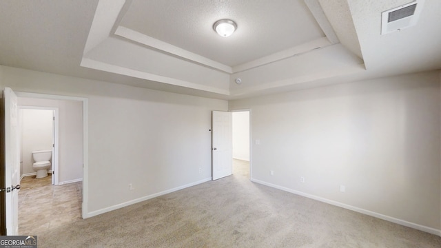 1001 Balsam Wood Trl, Villa Rica, GA 30180 - carpeted empty room with a tray ceiling and a textured ceiling