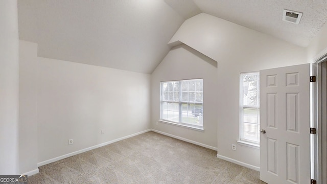 1001 Balsam Wood Trl, Villa Rica, GA 30180 - foyer featuring vaulted ceiling and light colored carpet