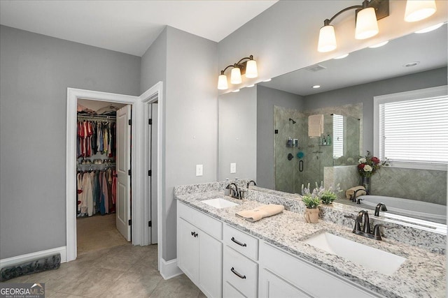 112 Sterling Lake Way, Jefferson, GA 30549 - full bath with a stall shower, a bath, a spacious closet, double vanity, and tile patterned flooring