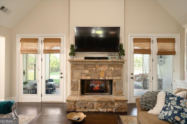112 Sterling Lake Way, Jefferson, GA 30549 - living room with wood-type flooring, healthy amount of natural light, high vaulted ceiling, and a stone fireplace