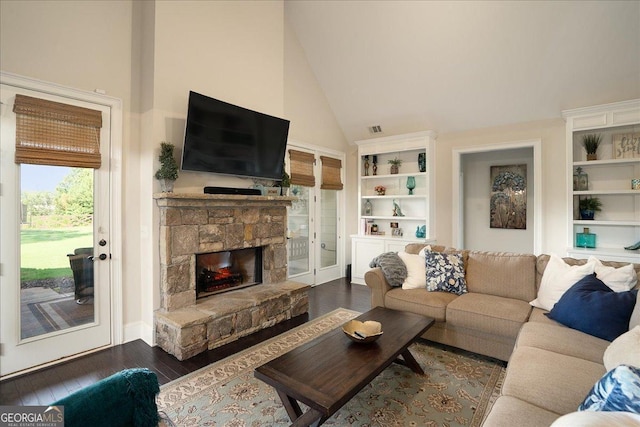112 Sterling Lake Way, Jefferson, GA 30549 - living room with dark wood-style flooring, high vaulted ceiling, a fireplace, and built in features