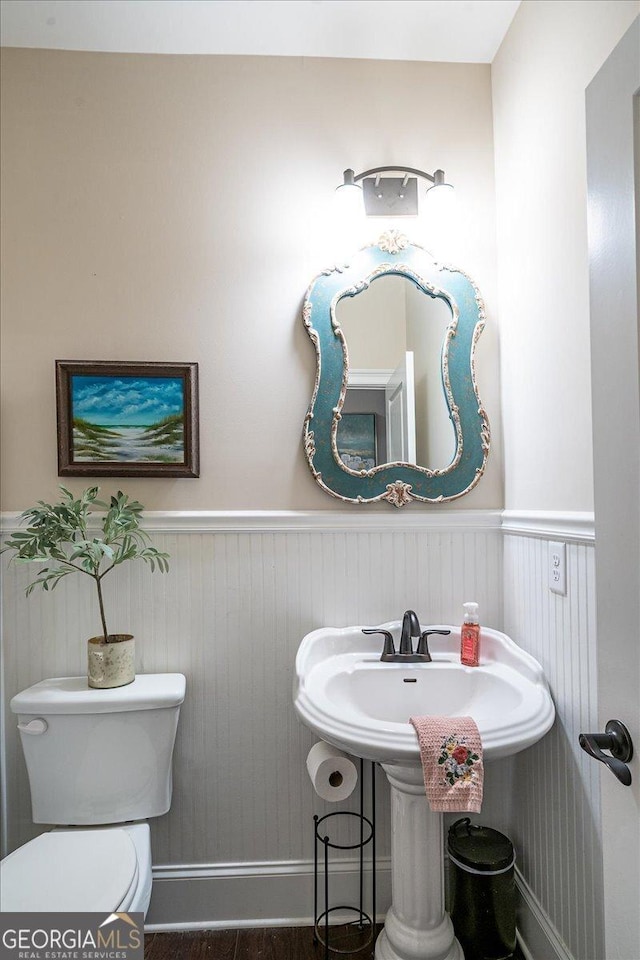 112 Sterling Lake Way, Jefferson, GA 30549 - half bath featuring toilet and a wainscoted wall
