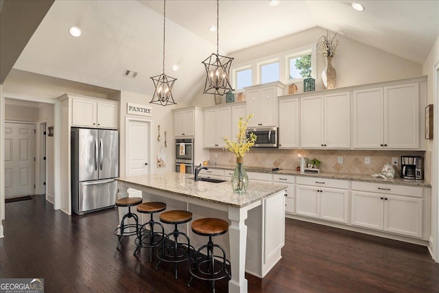 112 Sterling Lake Way, Jefferson, GA 30549 - kitchen featuring stainless steel appliances, white cabinetry, dark wood-type flooring, high vaulted ceiling, and recessed lighting