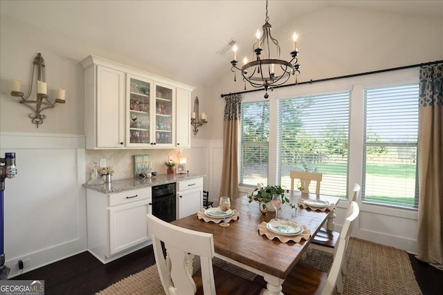 112 Sterling Lake Way, Jefferson, GA 30549 - dining area featuring vaulted ceiling, a chandelier, a wainscoted wall, healthy amount of natural light, and a dry bar