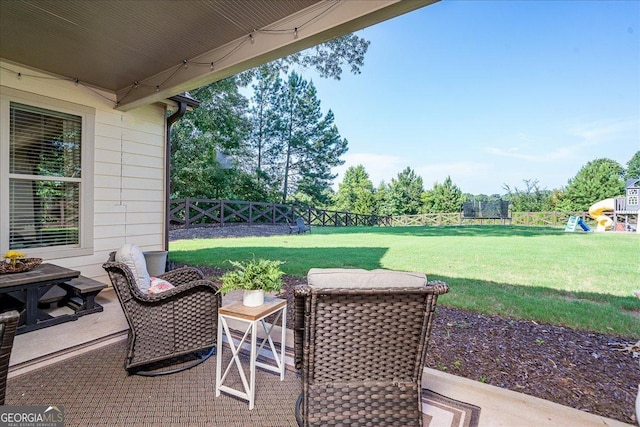 112 Sterling Lake Way, Jefferson, GA 30549 - fenced backyard featuring a patio, a trampoline, and a playground