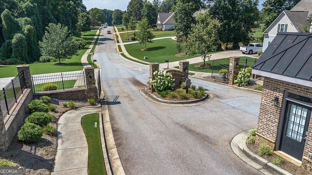 112 Sterling Lake Way, Jefferson, GA 30549 - view of asphalt street featuring curbs and sidewalks