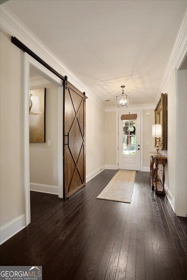 112 Sterling Lake Way, Jefferson, GA 30549 - entrance foyer featuring a barn door, wood-type flooring, a chandelier, and ornamental molding