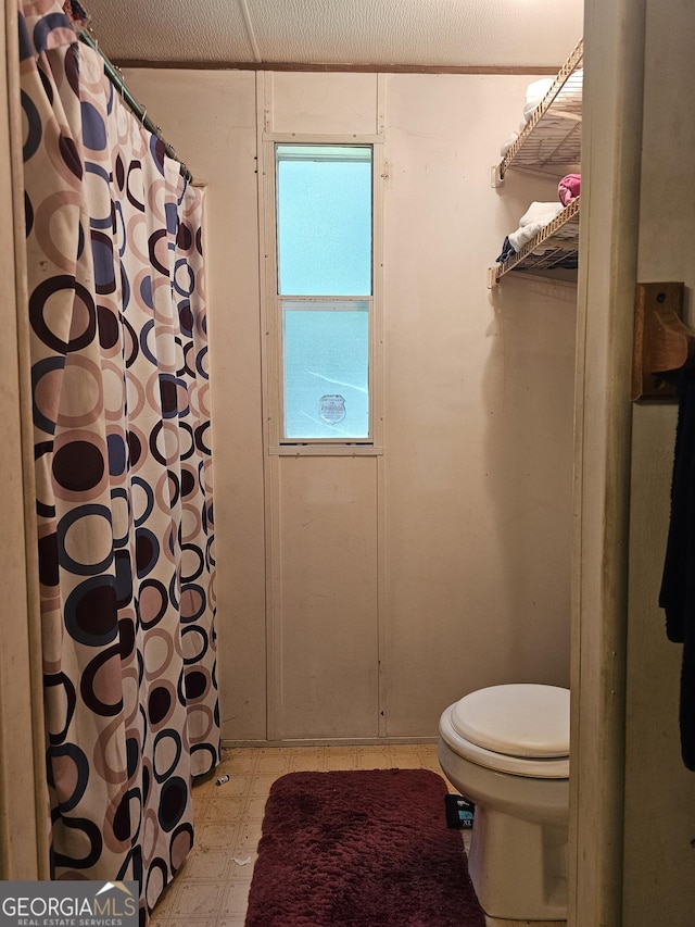74 Holly Dr, Carrollton, GA 30116 - bathroom with tile patterned floors and a shower with curtain