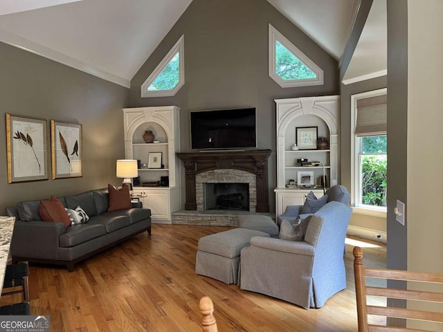 605 Meadows Creek Dr, Johns Creek, GA 30005 - living room with high vaulted ceiling, light wood-type flooring, a fireplace, and built in features