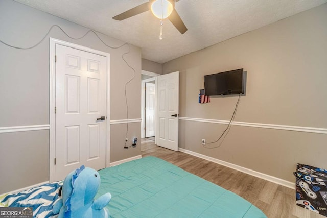 2895 Dominion Walk Ln, Snellville, GA 30078 - bedroom featuring wood finished floors and ceiling fan
