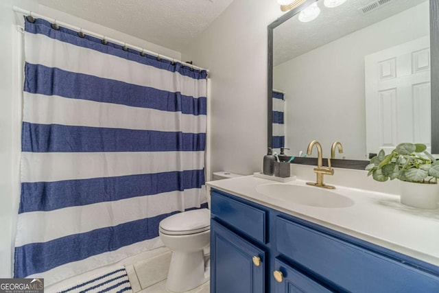 2895 Dominion Walk Ln, Snellville, GA 30078 - bathroom featuring vanity, tile patterned flooring, and a textured ceiling